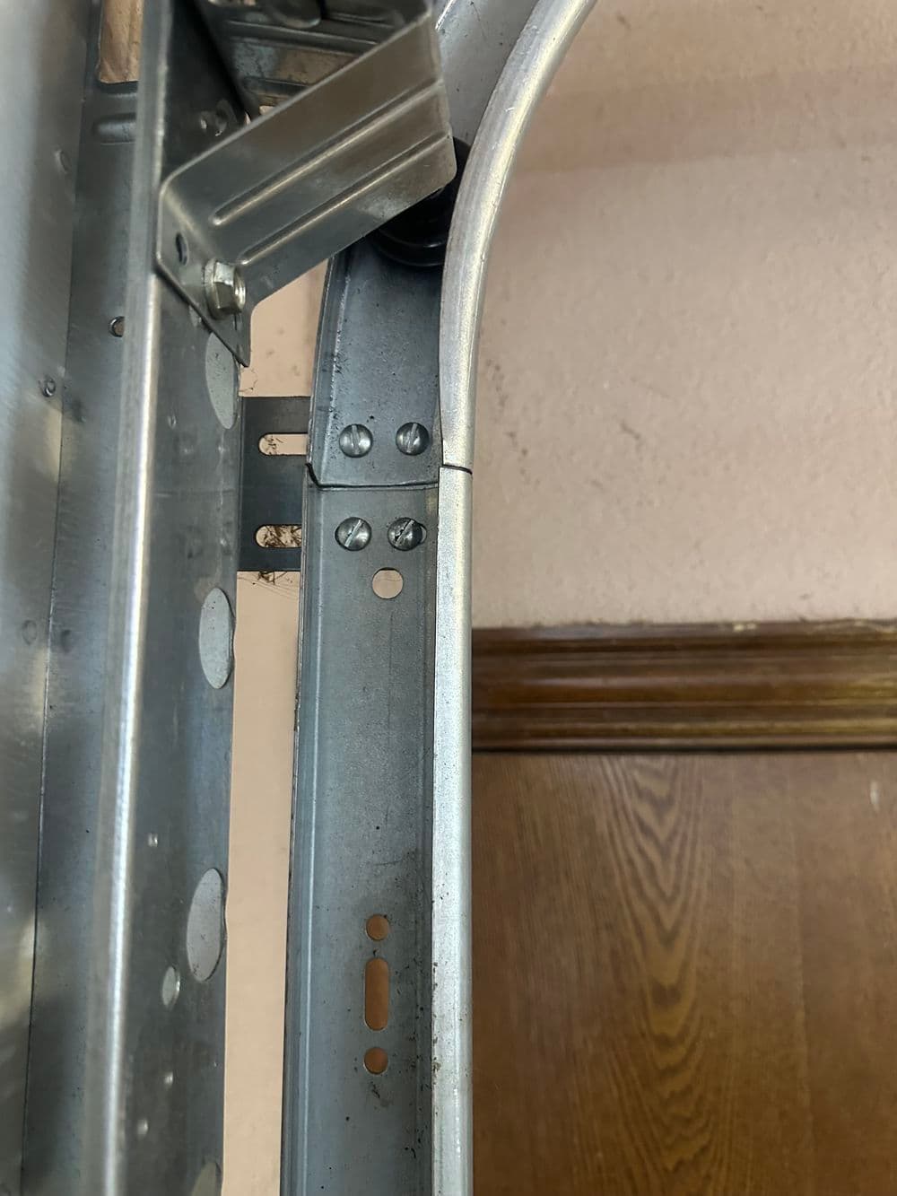 Close-up of metal frame with bolts and joints, highlighting structural detail and assembly.